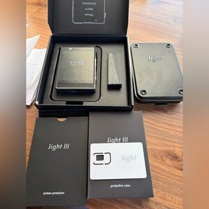 Light Phone III with Accessories. Unlocked brand new dumb phone
